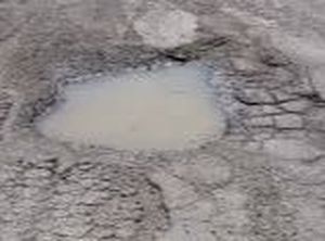 Pothole in Asphalt Driveway Jersey Strong Paving NJ